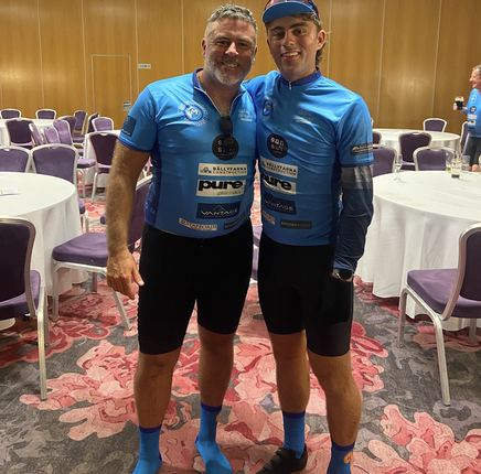 Damian and Adam in blue cycling kit at a post-ride event